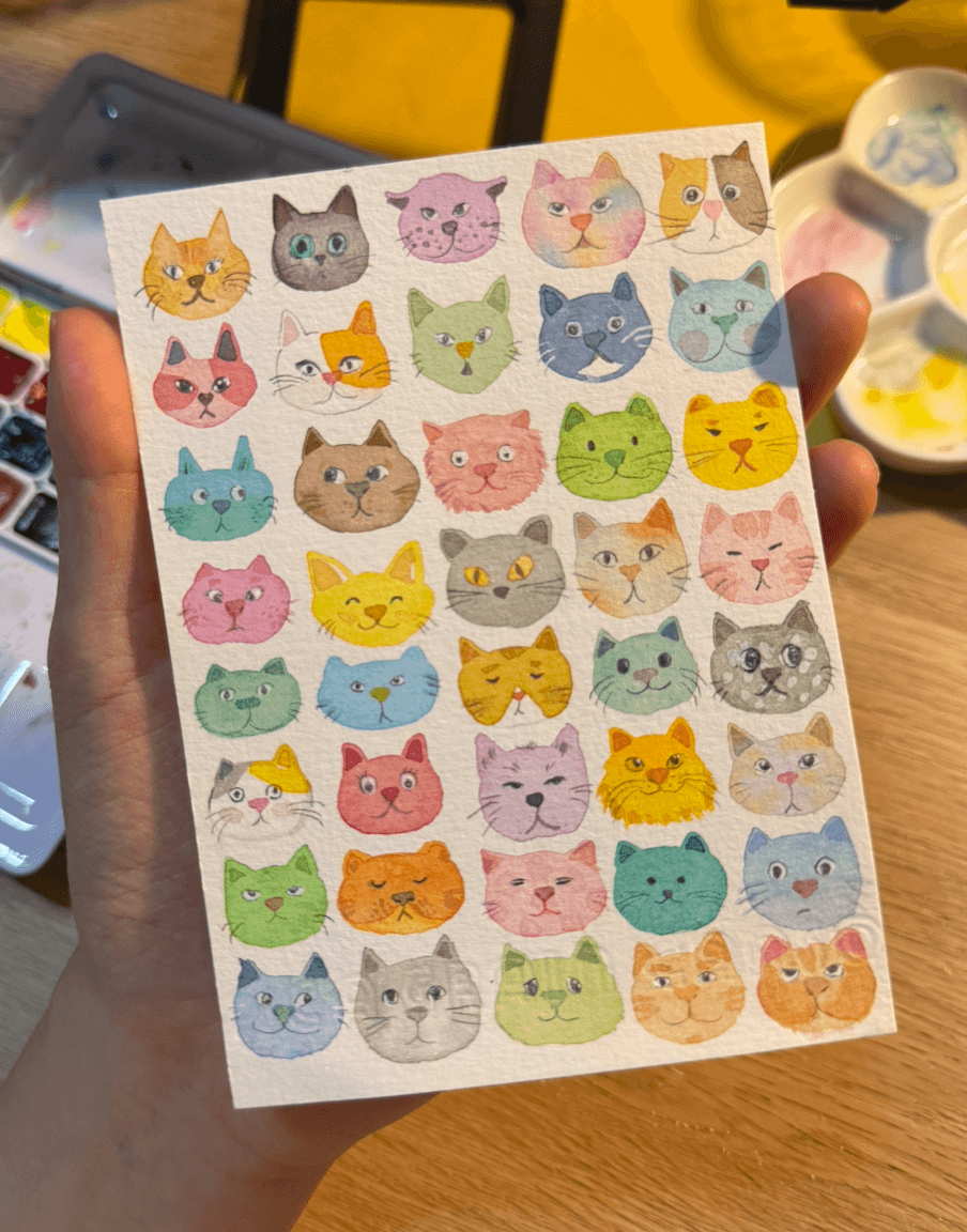 A sheet of colorful watercolor cats